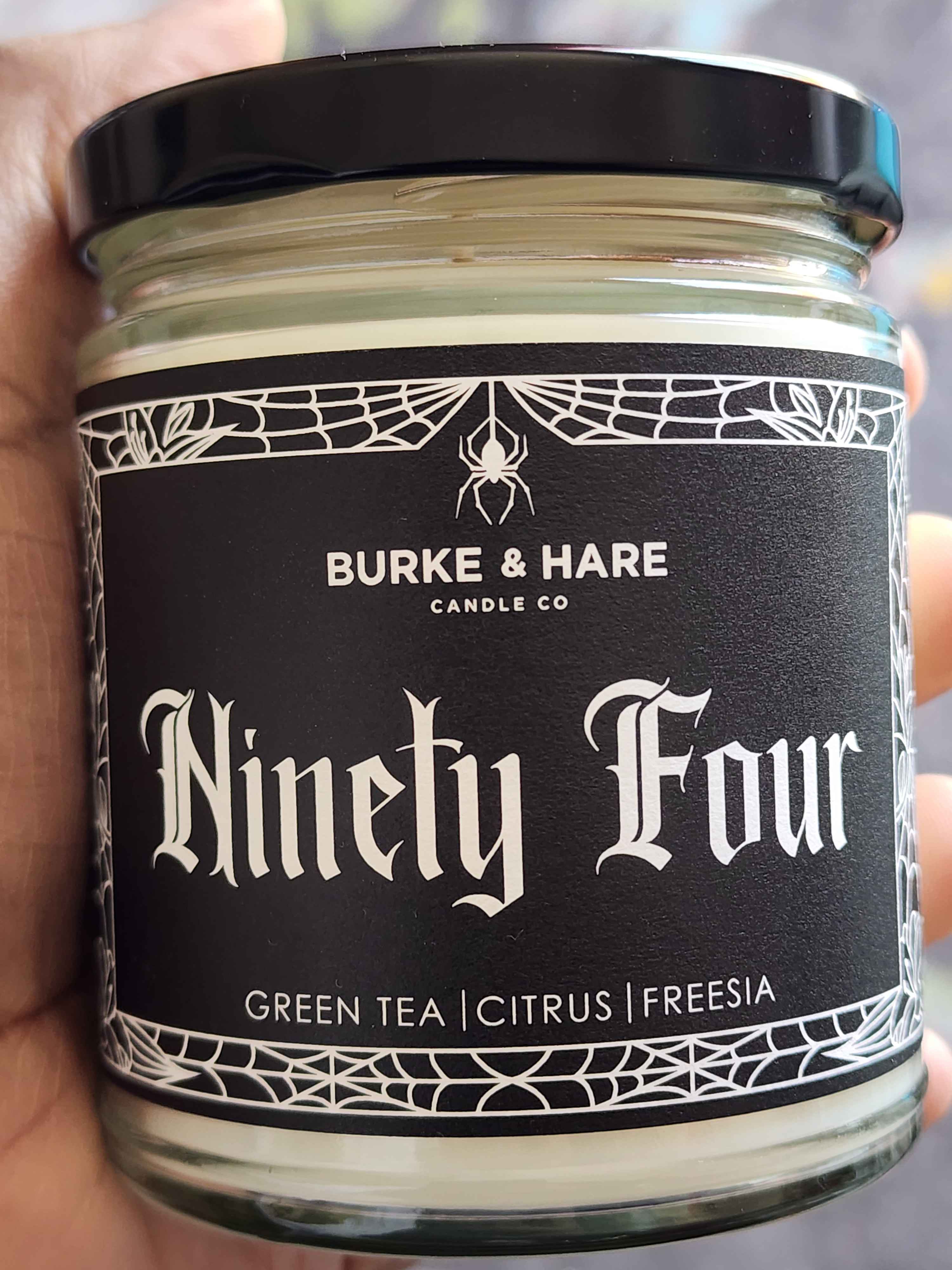 ID:  a candle from Burke & Hare Co described as a blend of green tea, citrus and freesia