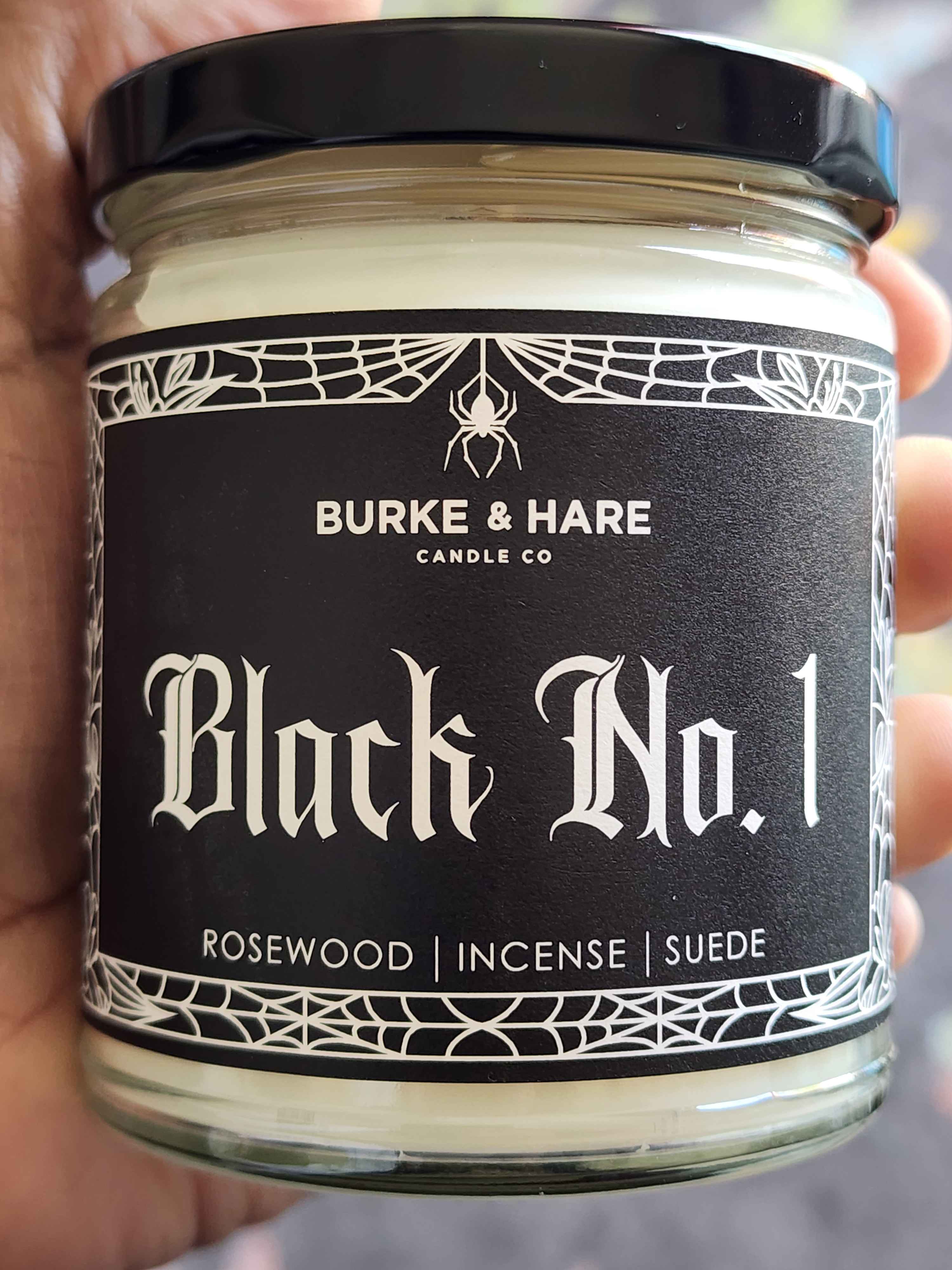 ID: a candle from Burke & Hare called Black Number 1, described as a blend of rosewood, incense, and suede