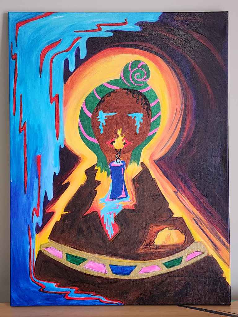 ID: A mountain reaches up to the heavens, surrounded in a yellow-orange glow.  Set into the mountain on the right is a cave where a stick figure huddles near a warm fire. Worn like a necklace around the mountain is a gold band set with emeralds, sapphires, and pink tourmaline.  Atop the mountain, a brown woman’s face weeps with closed eyes. Her black hair is wrapped in a green and bright pink turban. Her red lips are half-parted around the flame of a dark blue candle, centered between the mountain and her chin. A small pale blue waterfall spills from the bottom of the candle into the heart of the mountain, mirroring the larger waterfall with red streaks that spills down the left side of the canvas. The rest of the background is a purple-black sky. 